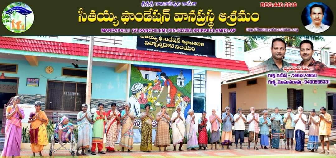Residents praying in front of the ashram buildings