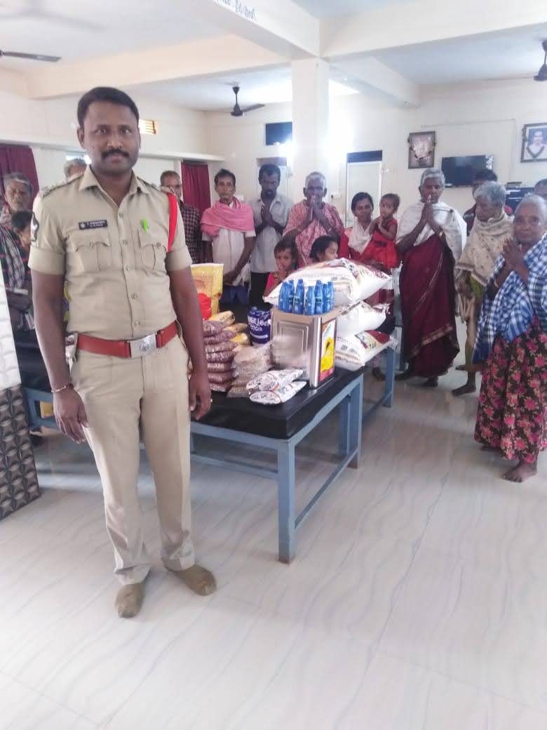 Sub-Inspector donating groceries to the foundation